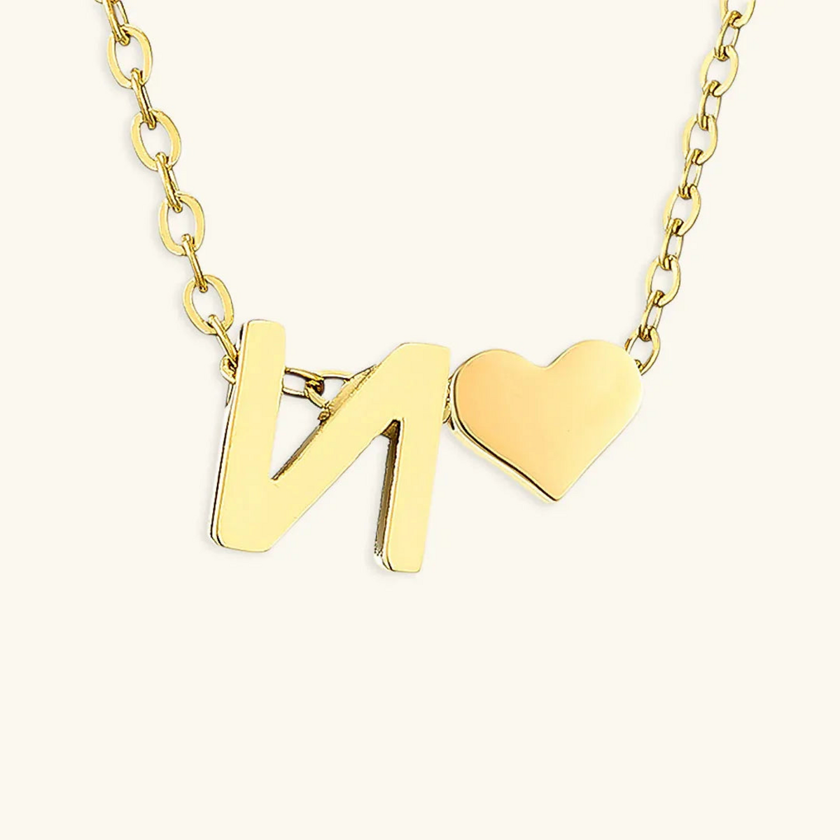 Seraya 14k yellow-gold PVD initial N and heart necklace on an ivory background