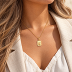 Angelisse Cherub Medallion Necklace — worn at realistic scale