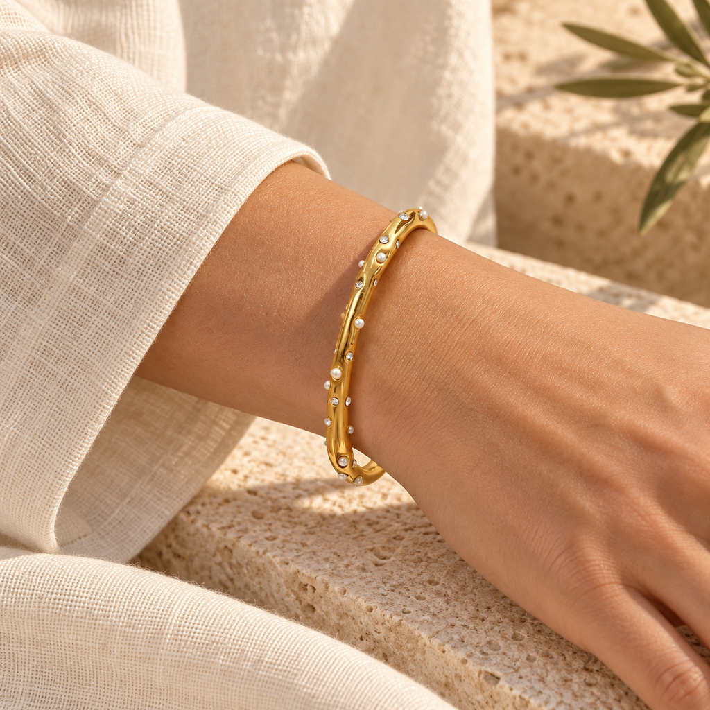 Coravelle pearl and crystal cuff resting naturally around an adult wrist