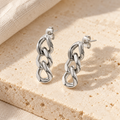Curbelle Three-Link Drop Earrings — construction and finish detail