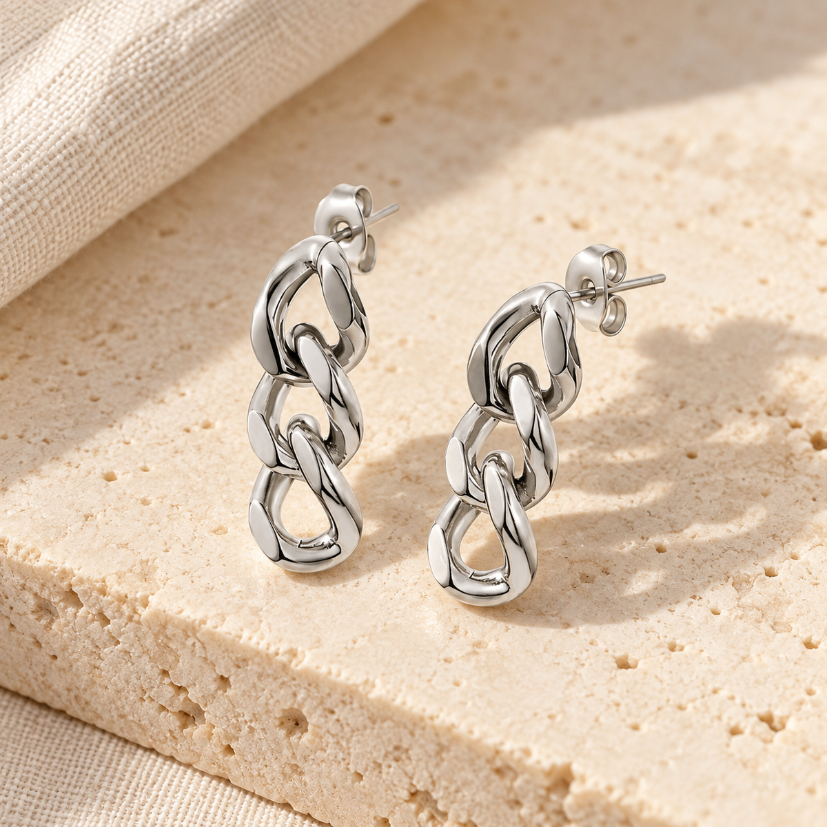 Curbelle Three-Link Drop Earrings — construction and finish detail