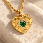 Elarisse engraved heart, green stone and raised rosette settings in detail