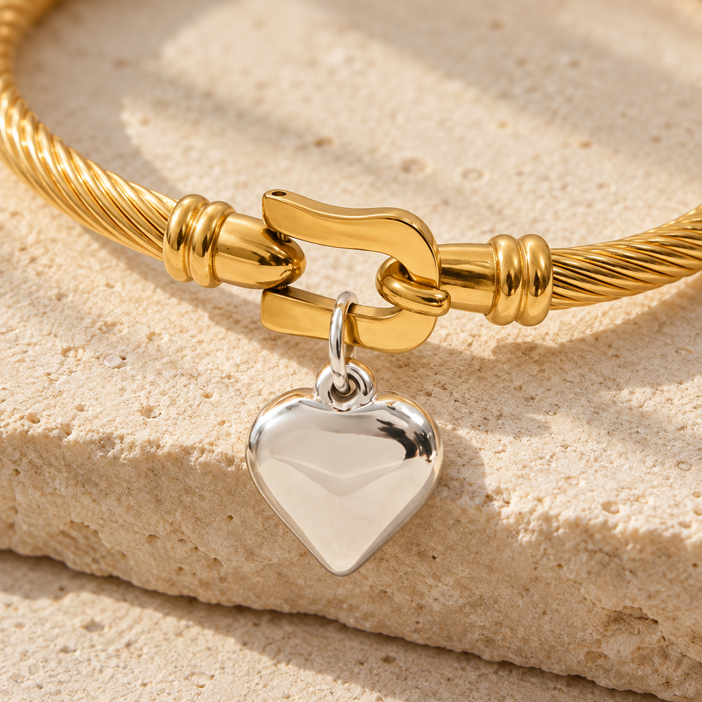 Close-up of Elunara clasp, twin terminal ridges and silver heart attachment