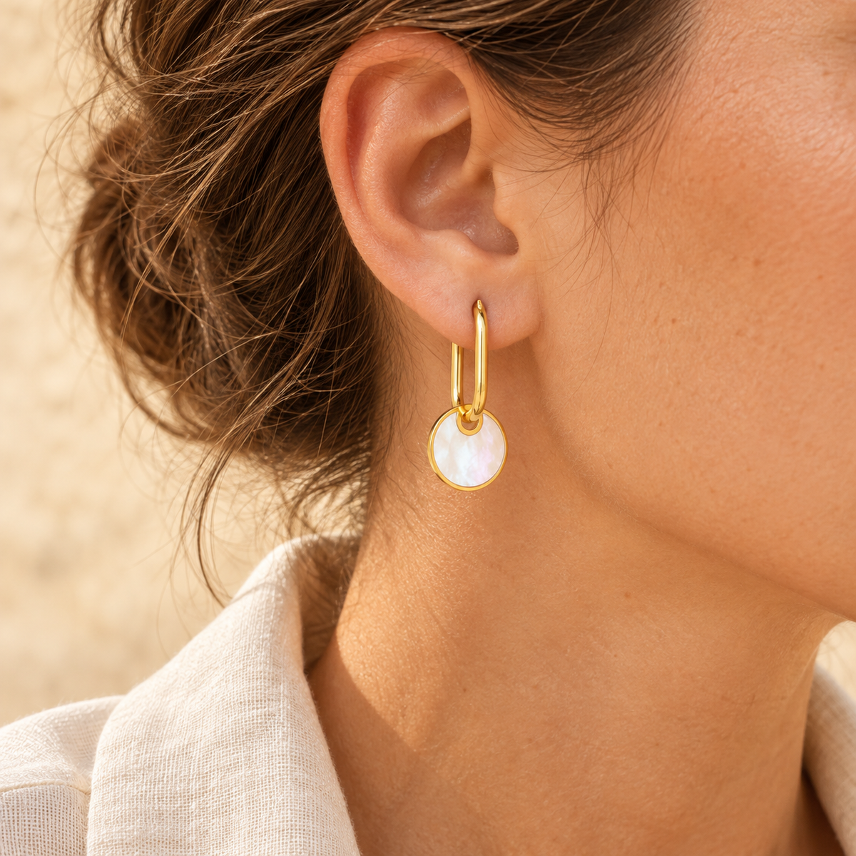 Nacrelle Shell Disc Drop Hoops — worn at realistic scale