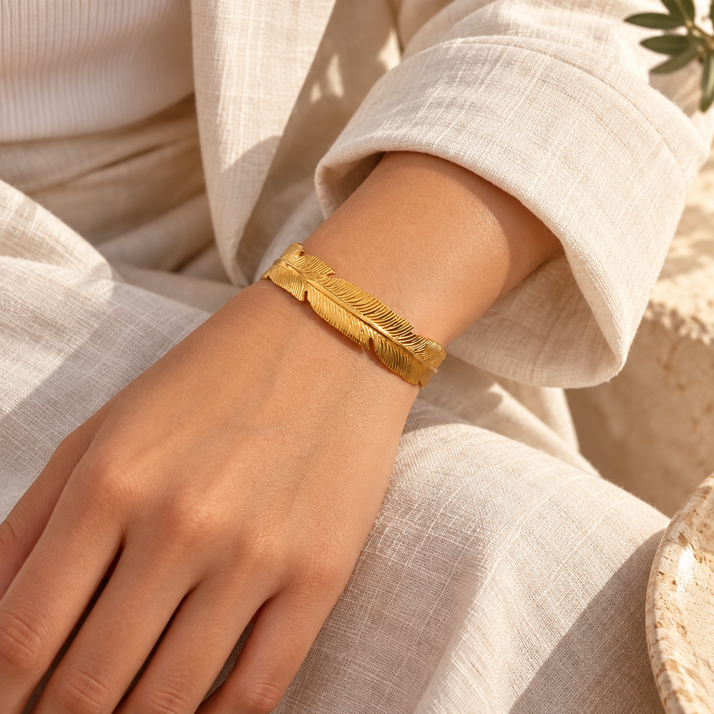 Pennavie Sculpted Feather Cuff — worn at realistic scale