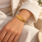 Pennavie Sculpted Feather Cuff — worn at realistic scale